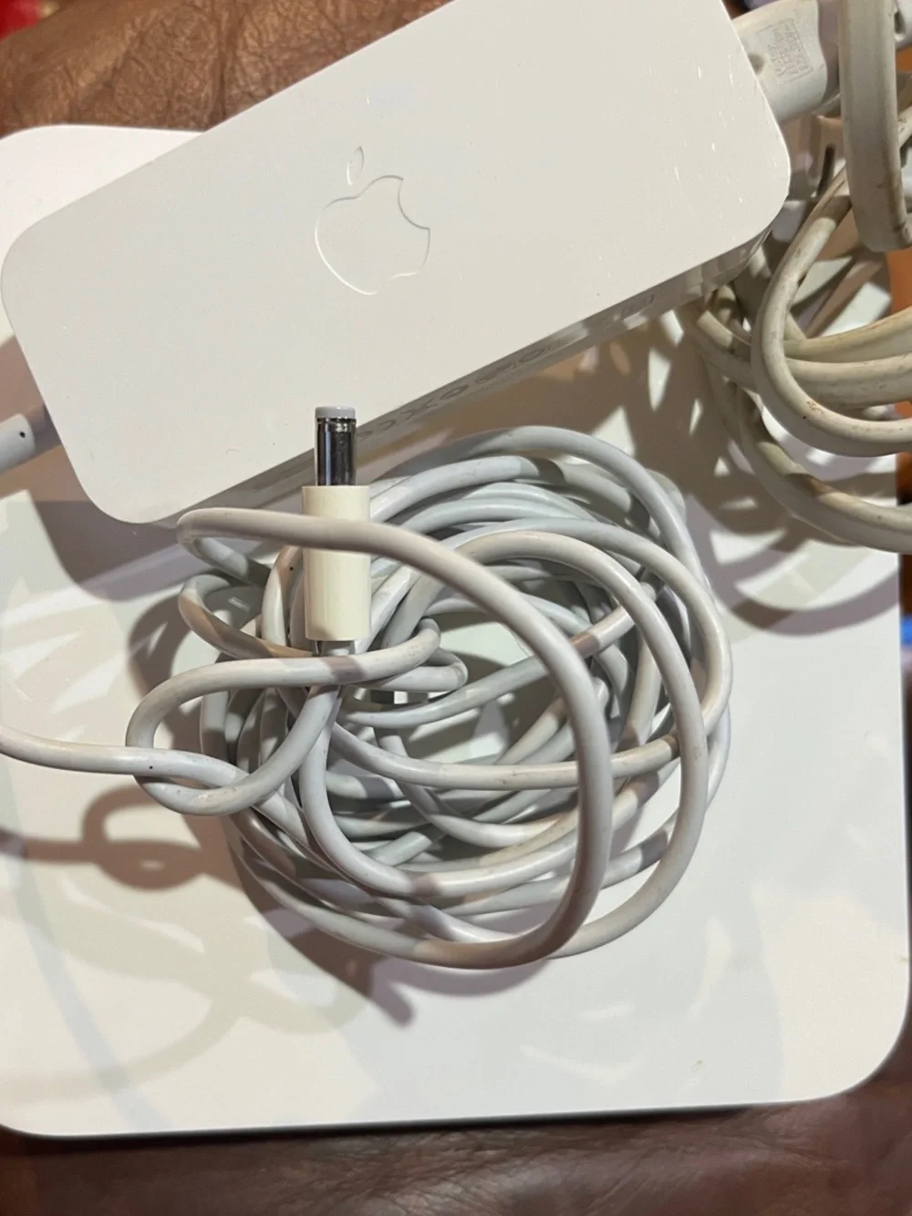 Apple AirPort Extreme base station with power supply.